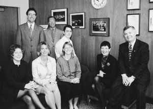Chairman David Koon (right) is joined by Commission and office staff.  Seated left to right:  Elizabeth Hoffman, Echo Cartwright, Elizabeth Meer, Anthony Best and Marilyn DuBois.  Standing left to right:  Kevin Younis and Richard Morse.