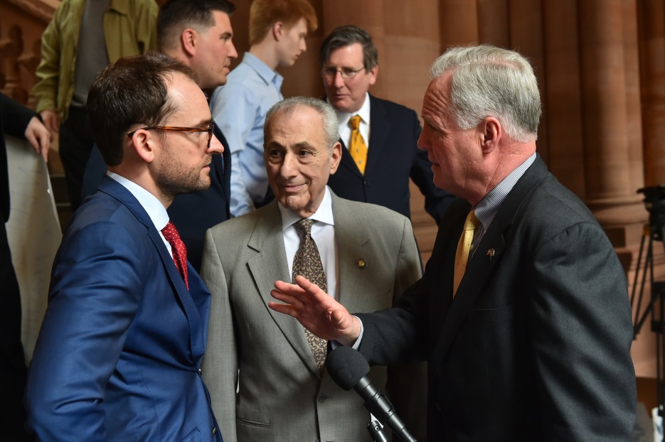 Assemblyman Michael Fitzpatrick (R,C,I,Ref-Smithtown), right, speaks with Brandon Muir, executive director of Reclaim New York, left, and colleague Assemblyman Joseph Errigo at a press conference held