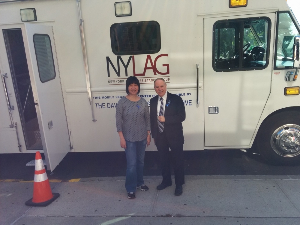 Assemblymember William Colton and his Community Relations Director, Nancy Tong, at a community information event organized with the New York Legal Assistance Group for constituents in front of his Dis