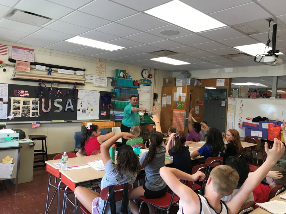 Assemblyman Karl Brabenec [front] listens to public policy ideas from students at Minisink Valley Intermediate School Friday