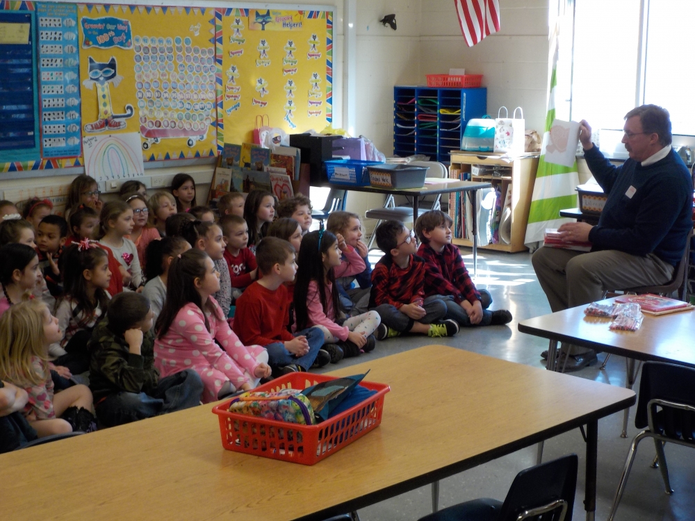 (Left): The first graders at Ostrander Elementary created Valentines for seniors with Assemblyman Brian Miller.