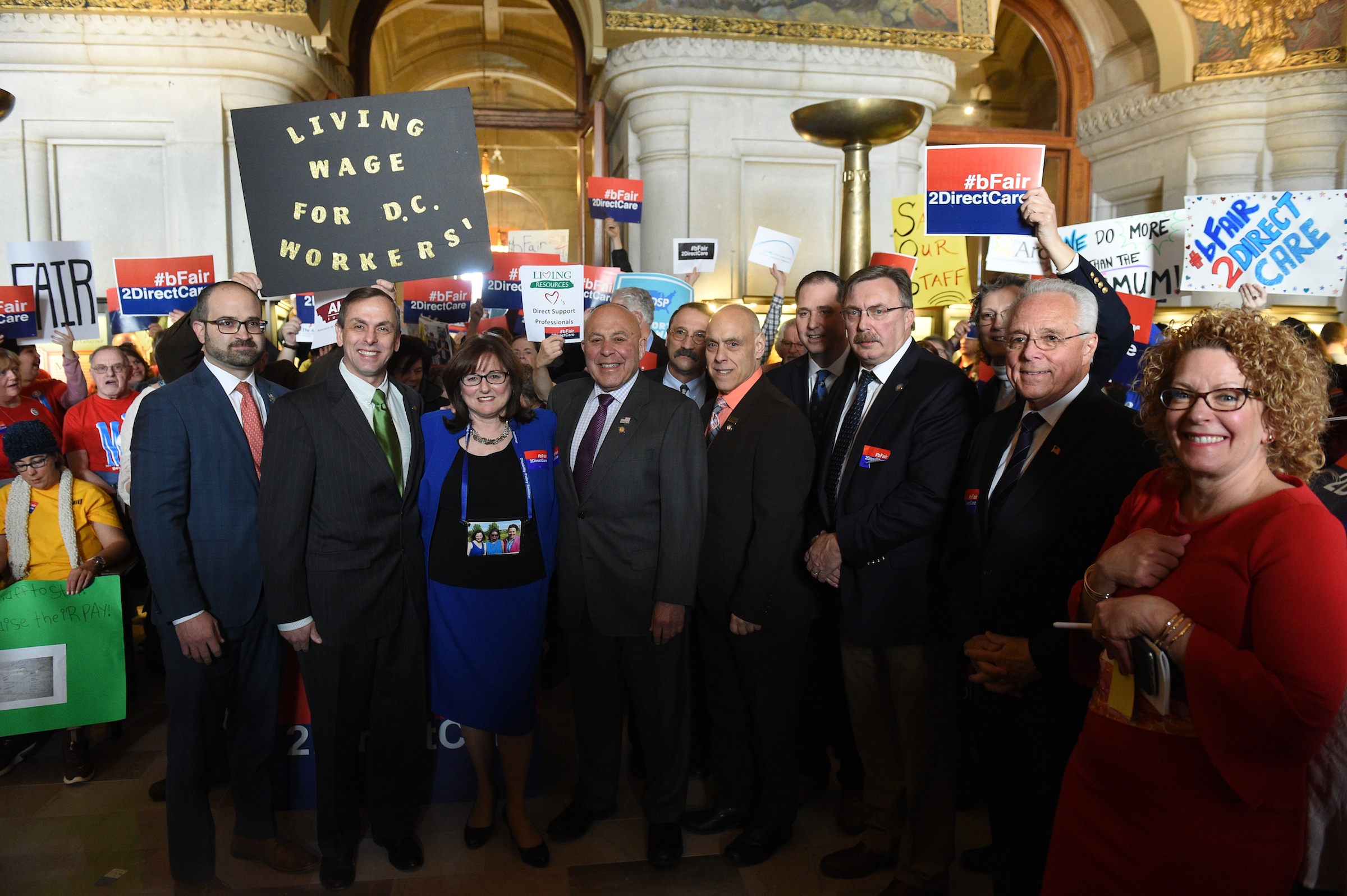 Assemblyman Brian Miller (third from right) rallies with Assembly members  and direct care advocates at the state Capitol on March 25, 2019.