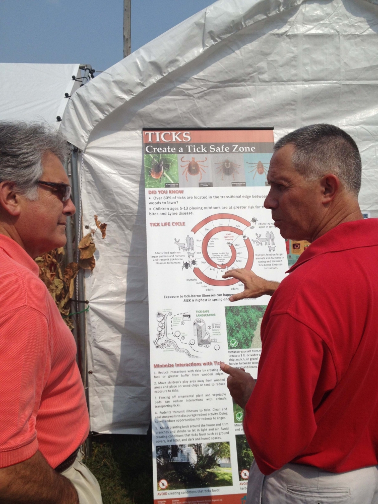 Assemblyman Al Stirpe visits with Cornell Cooperative Extension of Onondaga County Exec. Dir. David Skeval to hear more about the SNAP-Ed program, composting tutorial, prevention of invasive species a