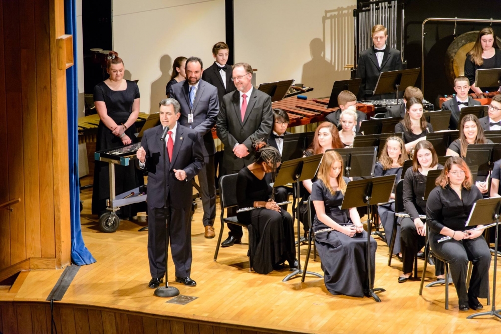 Assemblyman Magnarelli visited the West Genesee School District during the Festival of Bands event to announce a $150,000 state grant to purchase and replace musical instruments. Director of Fine Arts