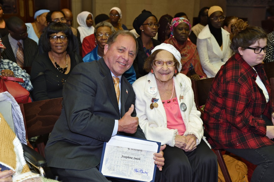 Assemblyman Hawley presents an official Assembly Citation to Josephine Smith in Albany Friday as the legislature celebrated visiting World War II veterans.